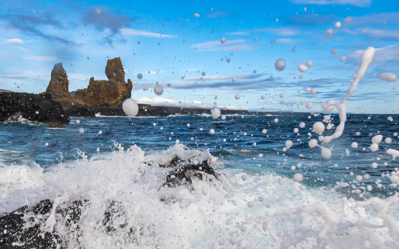 Lóndrangar through surf spray — Snæfellsnes