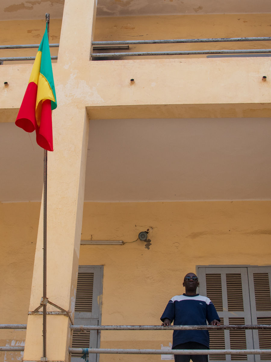 My guide through colonial Saint-Louis, Chierno Sow. He stands on the balcony inside of Lycée Faidherbe