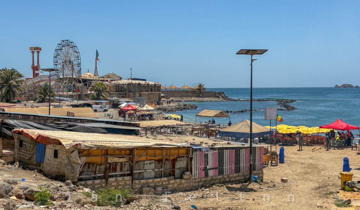 An amusement park along the corniche by food stalls