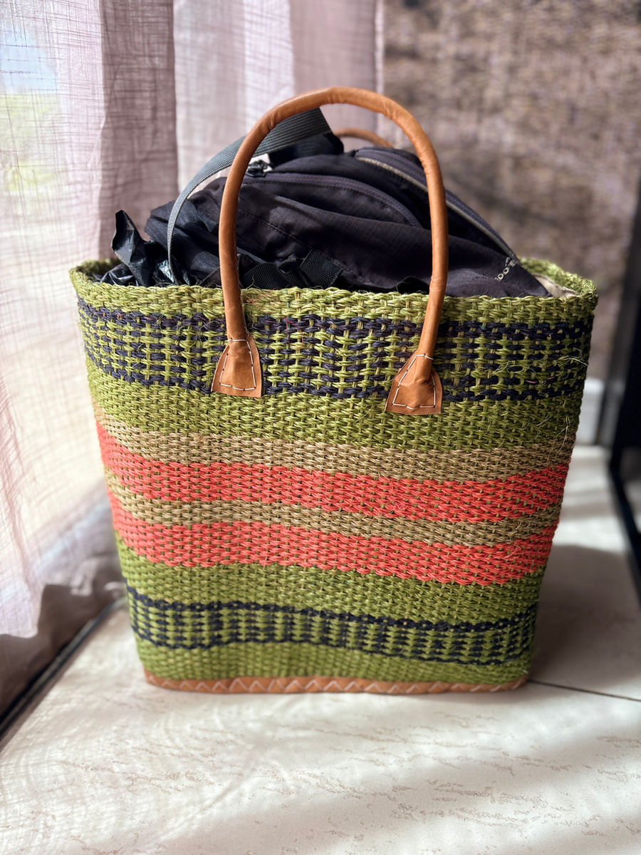 The woven basket with my carry on items